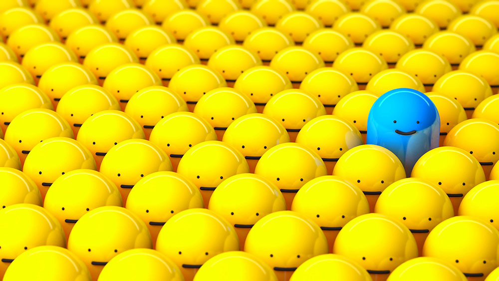 image of bright blue little cartoon man standing out from a crowd of little yellow cartoon men.